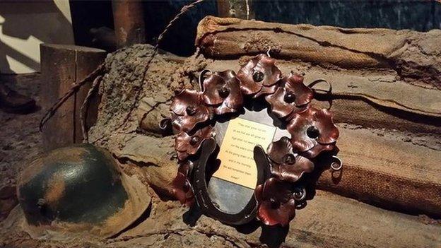 Ironwork wreath and a WWI helmet