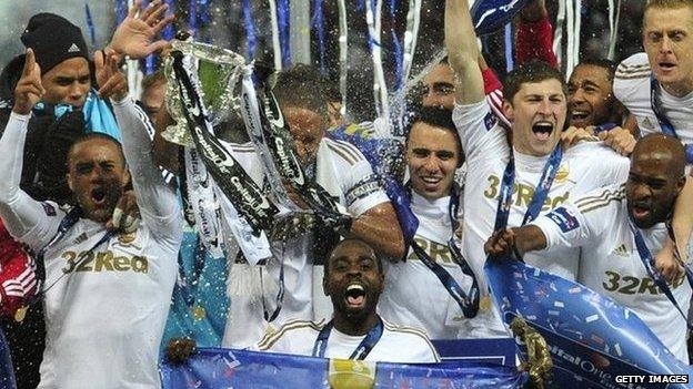 Swansea City celebrate winning the League Cup