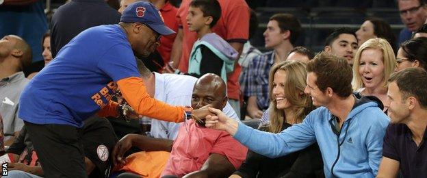 US film director Spike Lee introduces himself to Andy Murray during the basketball match at Madison Square Garden