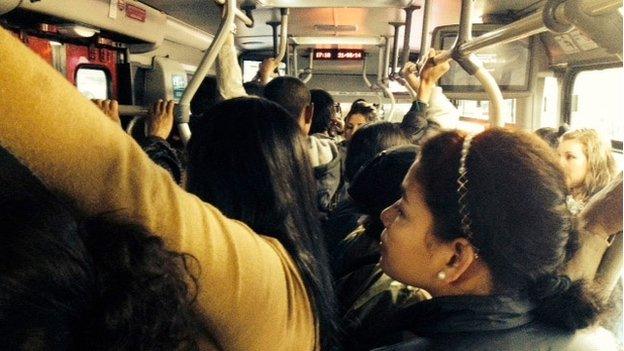 Passengers on board a Transmilenio bus in Bogota