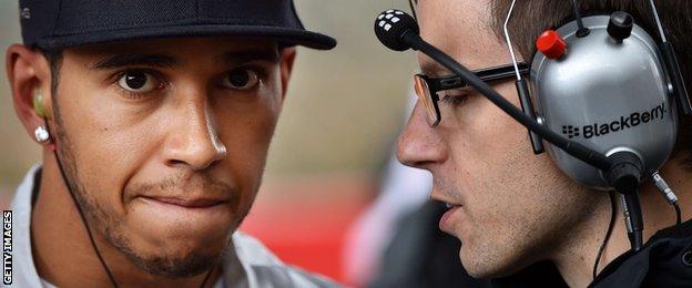 Hamilton talks to a Mercedes team-mate