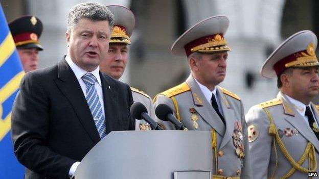 President Petro Poroshenko (left) speaks during an Independence Day parade in Kiev. Photo: 24 August 2014