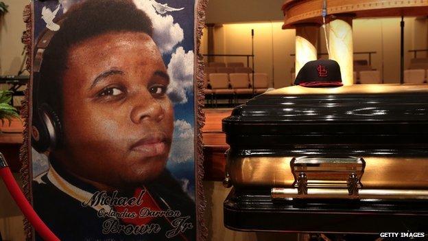 A painting of Michael Brown is displayed in front of his coffin during his funeral on 25 August.