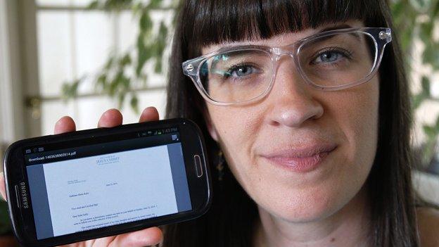 Kate Kelly shows a digital copy of the letter which informed her of her excommunication