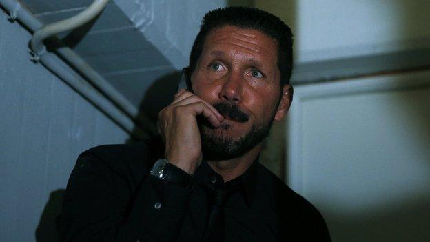 Atletico Madrid coach Diego Simeone watches from the stands