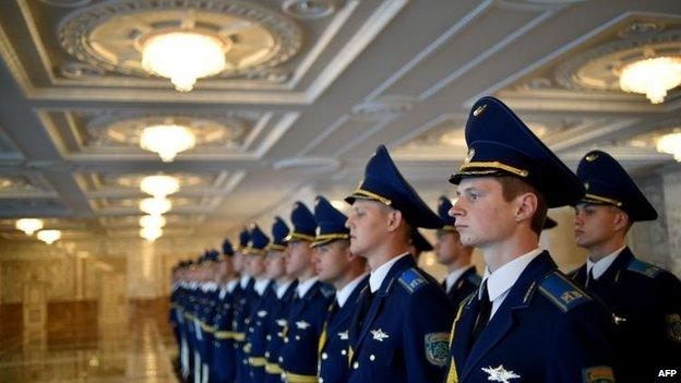 A Belarusian honour guard awaits the start of the summit in Minsk, 26 Aug