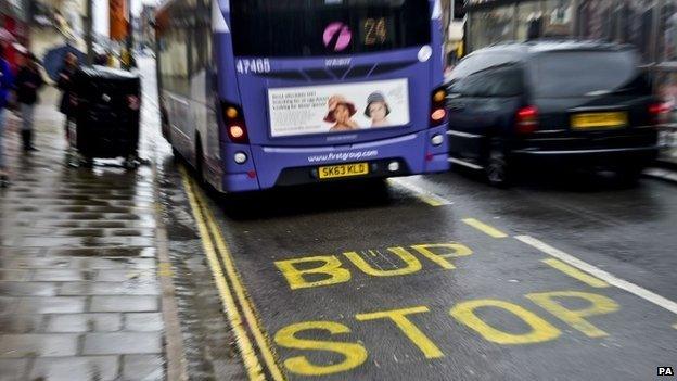 Bup stop sign in Bristol with bus stopping