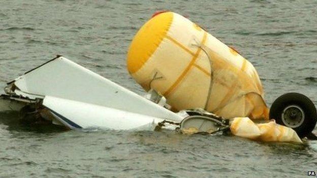 Helicopter wreckage being salvaged