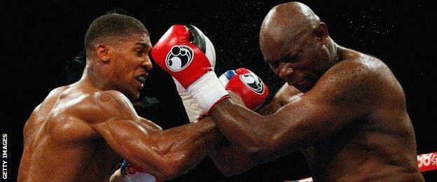 Anthony Joshua connects with a right against Matt Skelton