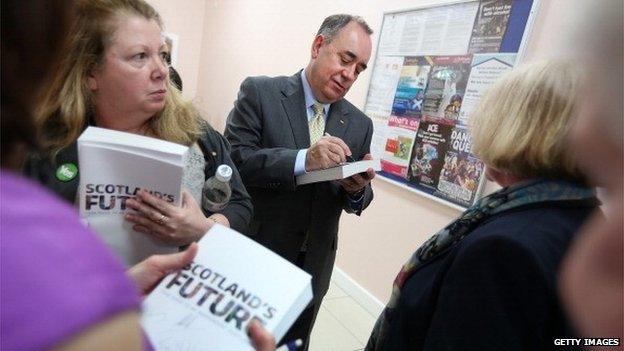 Alex Salmond signs copies of the White Paper on independence