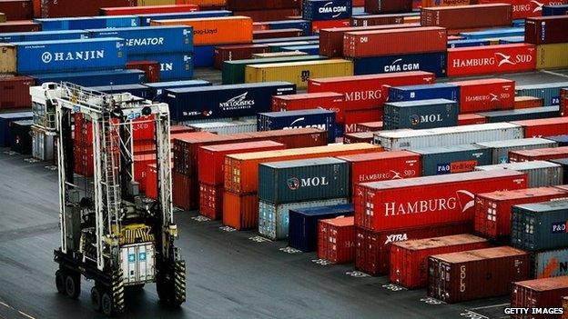 Ship freight container transporters move amongst freight containers on Tilbury Dock on February 1, 2007 in Tilbury, England.