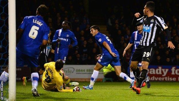 Gillingham's John Egan puts into his own net