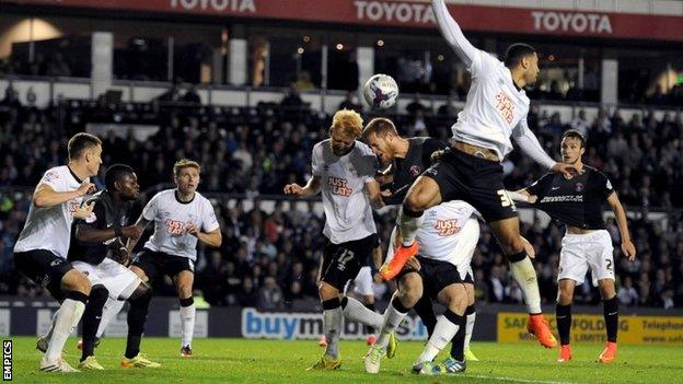 Derby County's Zak Whitbread (centre left) and Charlton Athletic's Michael Morrison (centre right) battle for the ball