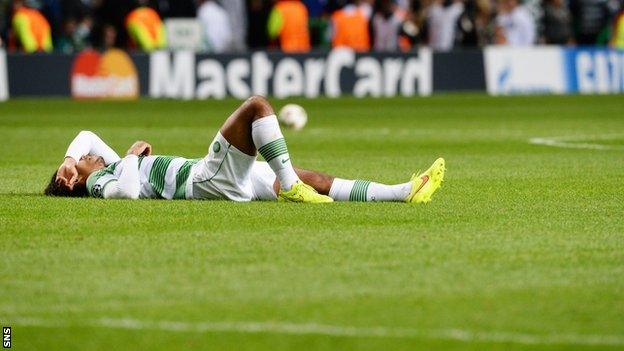 Celtic's Virgil van Dijk lies dejected after the 1-0 defeat by Maribor.