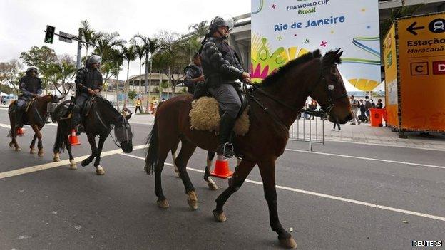 Brazilian mounted riot police patrol outside the Maracana stadium in Rio de Janeiro on 22 June, 2014