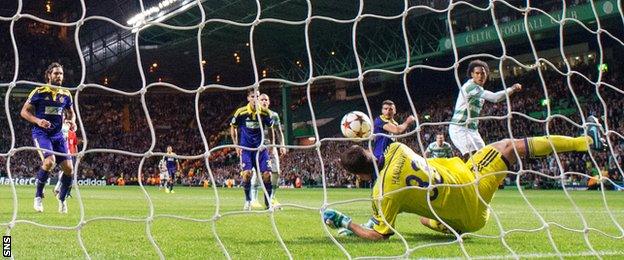 NK Maribor goalkeeper Jasmin Handanovic makes a save to deny Celtic defender Virgil van Dijk