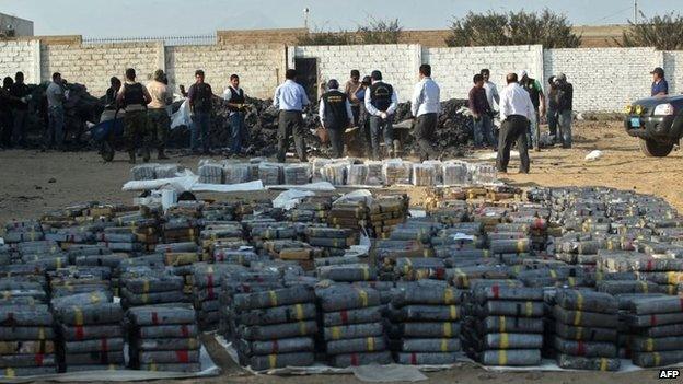 Picture showing policemen taking part in the destruction of part of at the more than three tonnes of cocaine seized in Trujillo on 26 August, 2014