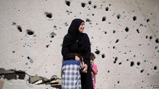 Palestinians mourn two teenaged brothers killed in Israeli air strikes in Gaza on 26 August 2014