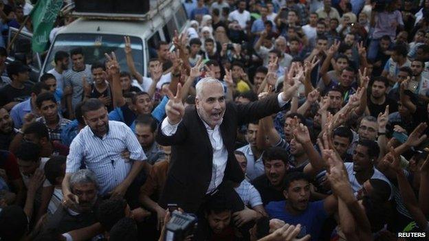 Hamas spokesman Fawzi Barhoum celebrates in Gaza City after the ceasefire announcement (26 August 2014)