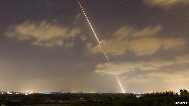 A rocket is launched by militants in the Gaza Strip towards Israel (21 August 2014)