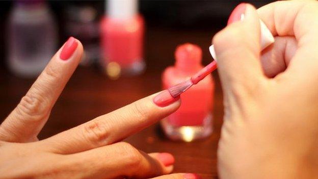 woman painting nails