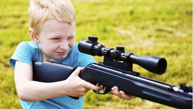 Boy with rifle