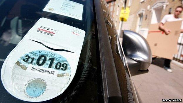 Car tax disc displayed in windscreen