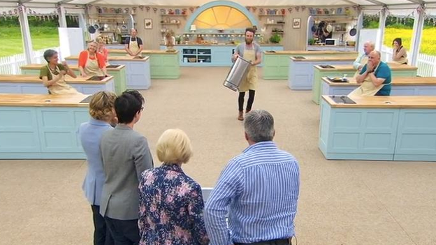 Iain bringing his bin up to the Bake Off judges