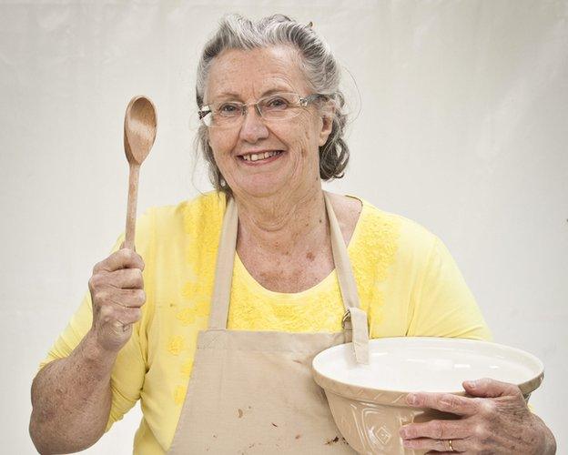 Diana holding a spoon and a bowl