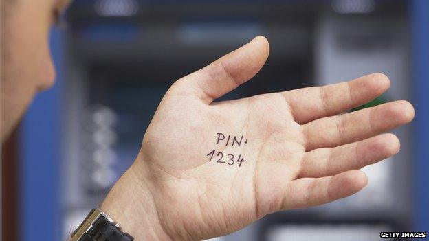 Man's hand with 1234 PIN written on it