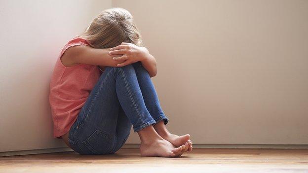 Model posed picture of child on floor