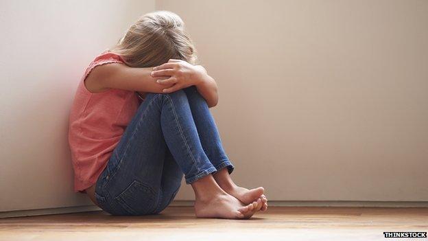 Model posed picture of child on floor