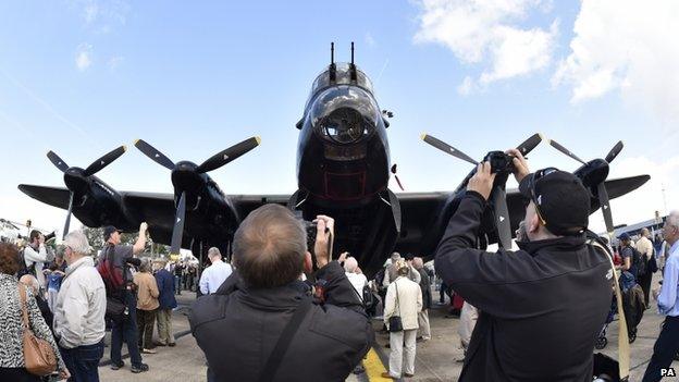 Enthusiasts take pictures of the Lancaster Bomber