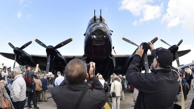 Enthusiasts take pictures of the Lancaster Bomber