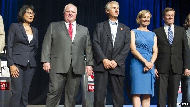 Toronto mayoral candidates Olivia Chow (L), Toronto Mayor Rob Ford (2nd L), David Soknacki, Karen Stintz (2nd R) and John Tory (R) pose for a photo after a mayoral debate hosted by the Canadian Tamil Congress in Scarborough, Ontario 15 July 2014