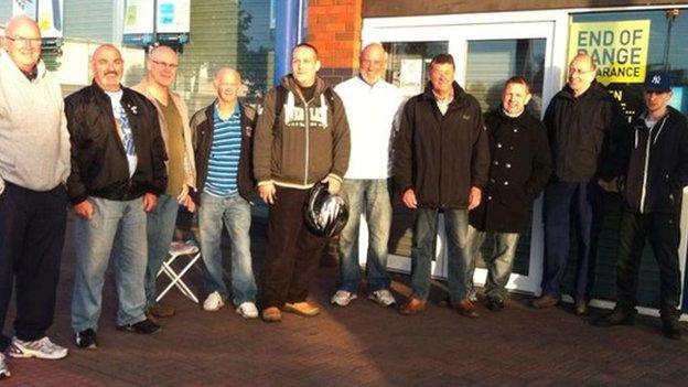 Football fans queuing to buy tickets