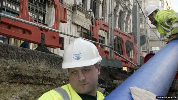 Thames Water worker fixing sewer