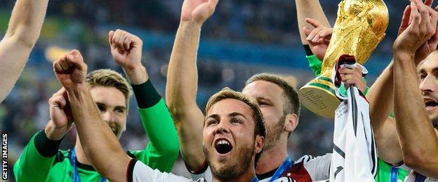 Germany celebrate with the World Cup trophy