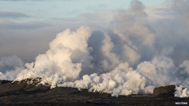 Steam and smoke rise over a 1-km-long fissure in a lava field north of the Vatnajokull glacier, which covers part of Bardarbunga volcano system