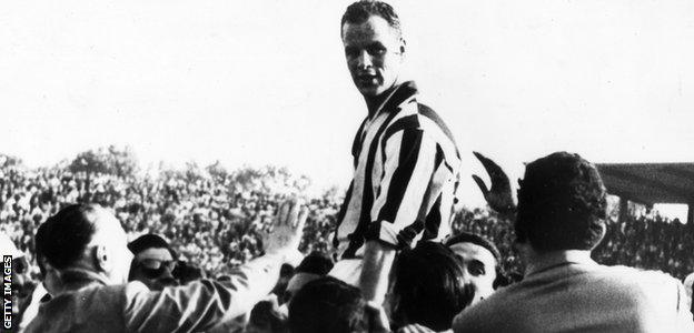 Welsh footballer John Charles is held aloft by supporters after he led his team Juventus to victory in the 1958 Italian Cup at Turin