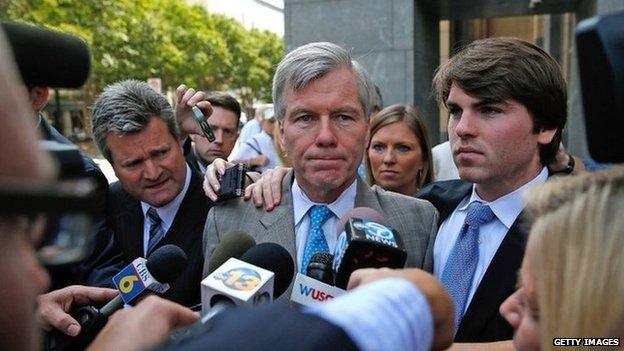 Former Virginia Governor Bob McDonnell (C) leaves his trial at U.S. District Court with his son Bobby (R) 28 August 2014