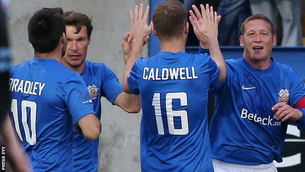 Kris Lindasy (right) celebrates scoring the opener against Ballymena