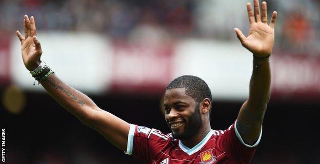 Alex Song acknowledges fans at the Boleyn Ground