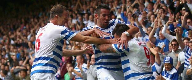 QPR players celebrate Charlie Austin's goal