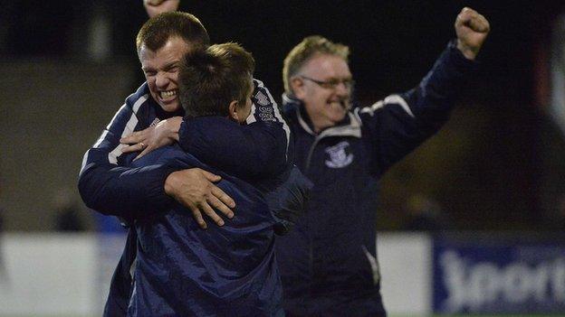 The Ballyclare management celebrate after their shock win over Linfield on Monday night