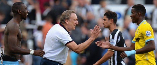 Neil Warnock greets Wilfried Zaha