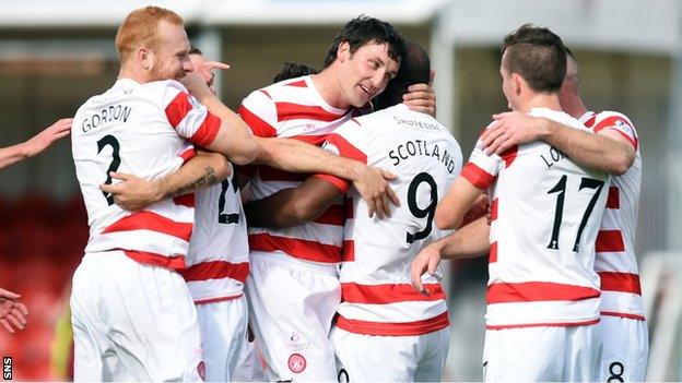 Jason Scotland is congratulated by Martin Canning after scoring Hamilton's fourth