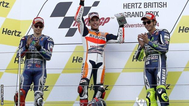 Marc Marquez (centre) flanked by Jorge Lorenzo (left) and Valentino Rossi