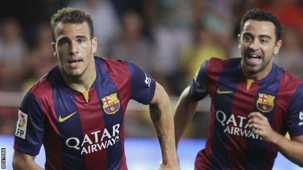 Barcelona's Sandro Ramirez (left) celebrates next to team mate Xavi Hernandez