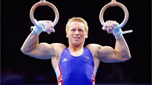 Craig Heap of Great Britain in action on the Rings in the Men's Gymnastics Individual All-Around Final at the Sydney 2000 Olympic Games